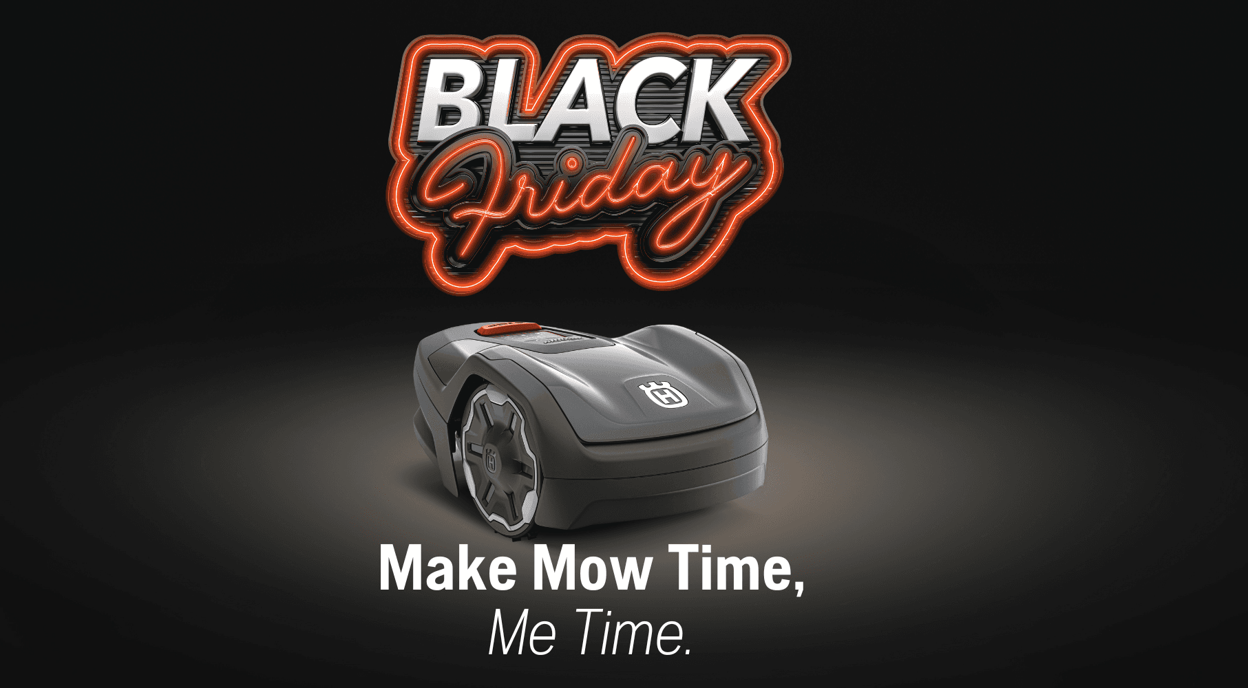 Automower sitting in grass patch in backyard with family cooking bbq in background